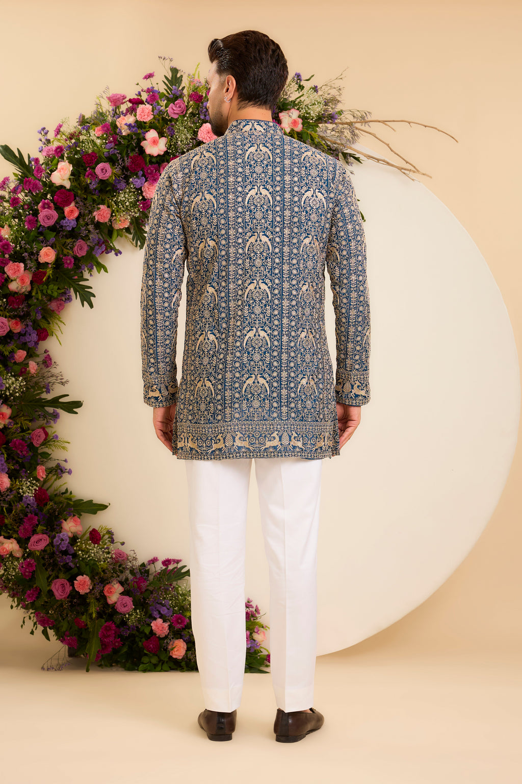 A Regal Blue short Kurta Woven with Ornate Zari Details