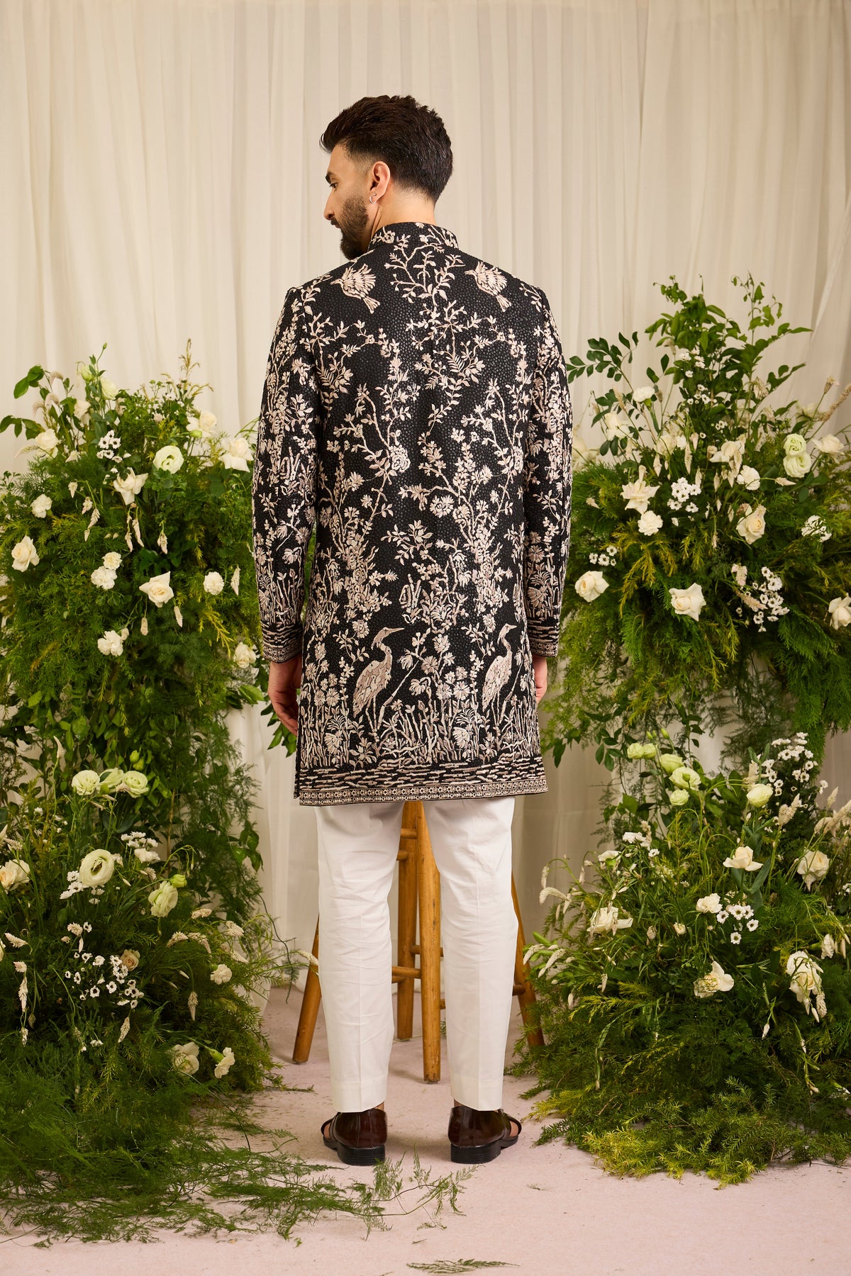 A Midnight Sequin short sherwani Embellished in Golden Threadwork and majestic flamingos
